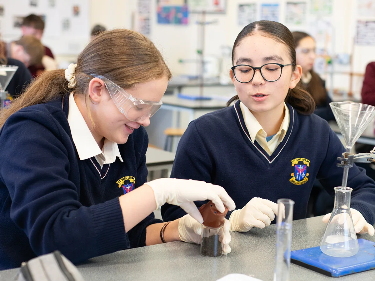 Students conducting a hands-on science experiment - St.Louis Community School