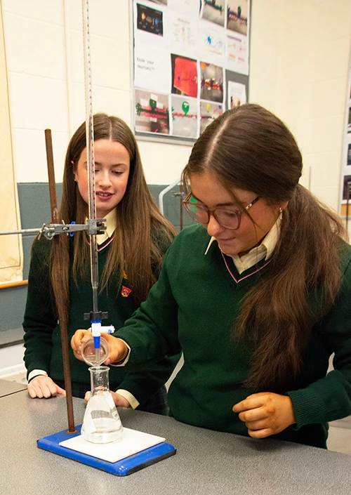Students conducting a science experiment - St.Louis Community School